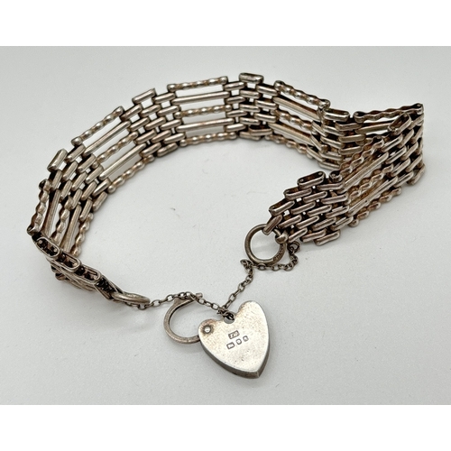 1060 - A vintage silver 7 inch 5 bar gate bracelet with safety chain and padlock clasp. Hallmarked to back ... 