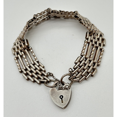 1060 - A vintage silver 7 inch 5 bar gate bracelet with safety chain and padlock clasp. Hallmarked to back ... 