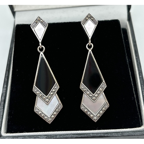 1061 - 2 pairs of Art Deco design drop earrings set with black onyx. One pair in overlapping diamond design... 