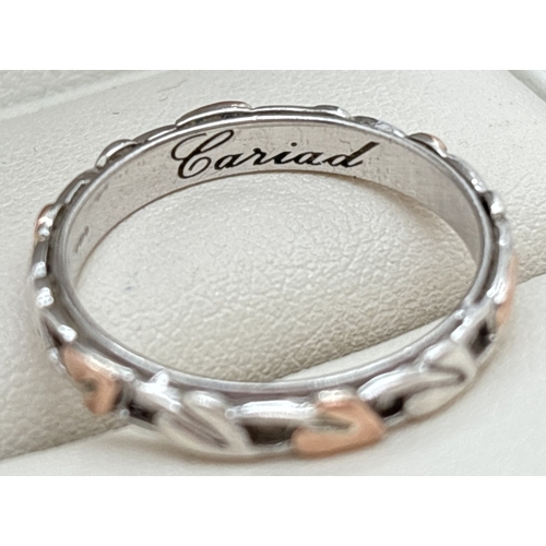 1067 - A 925 silver 4mm wide Tree Of Life band ring by Clogau with Welsh rose gold accent. Silver and gold ... 