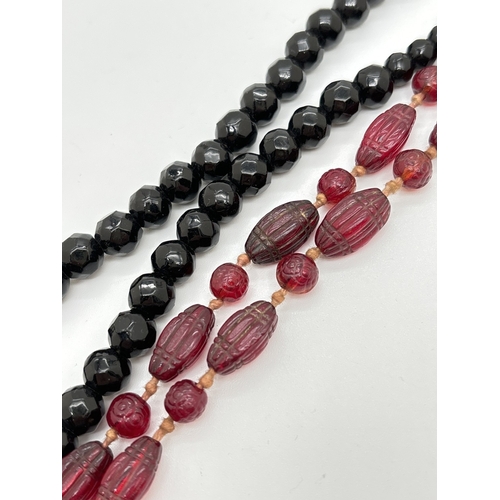 1097 - 2 vintage glass bead opera necklaces, both approx. 42 inches long. A faceted black glass bead neckla... 