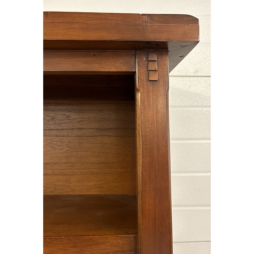 1462 - A large mango wood 'Zocalo' fixed shelf bookcase with panelled wood and peg design. Approx. 184cm ta... 