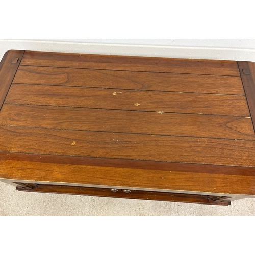 1463 - A large 'Zocalo' mango wood coffee table with double door cupboard and metal knob handles. With pane... 