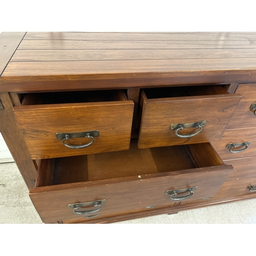 1465 - A large 'Zocalo' heavy solid mango wood 10 draw sideboard unit with heavy metal drop handles. Approx... 