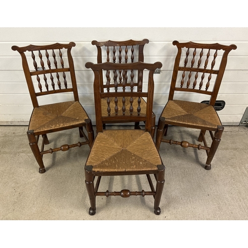 1468 - A set of 4 matching antique Lancashire spindle back chairs with rush seats and dark oak frames. With... 