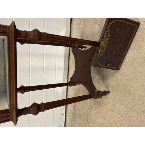 1469 - An antique French nightstand with marble lined pot cupboard and ornate bronzed metal moldings. With ... 