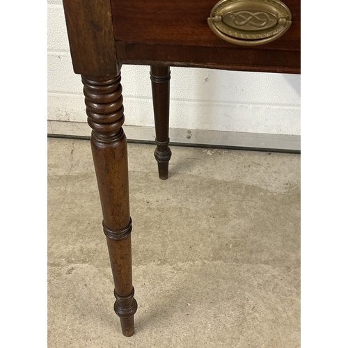 1470 - A Georgian dark wood 3 drawer side or writing table with turned legs. Brass drop handles (not origin... 