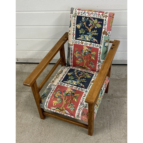 1481 - An Art Deco wood framed low child's chair with reclining back rest. Has been reupholstered. Approx. ... 