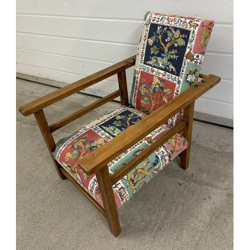 1481 - An Art Deco wood framed low child's chair with reclining back rest. Has been reupholstered. Approx. ... 