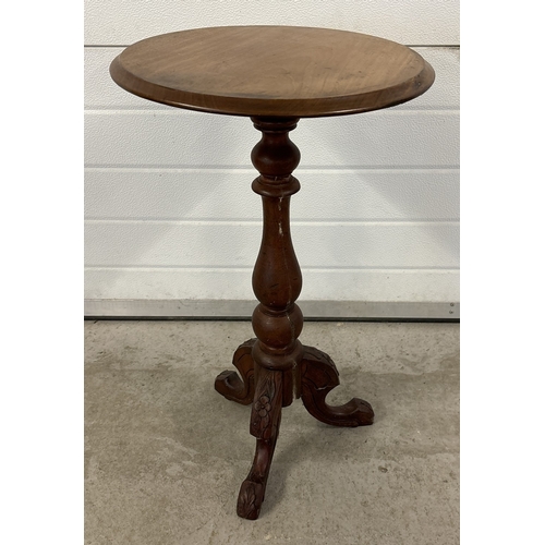 1490 - An early 20th century dark wood tripod table with turned pedestal and carved detail to feet. Approx.... 