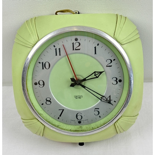 A vintage 1940's green Bakelite Smiths Sectric wall clock with square shaped stylised case. Black metal pierced detail hands, chrome ring face with numeral markers and original bakelite cased workings. Approx. 16.5 x 16.5cm.