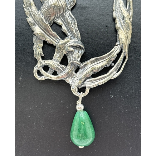 1109 - A large Art Nouveau design silver pendant with a teardrop shaped jade drop, on an 18