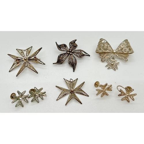 1080 - A small collection of silver and white metal vintage filigree jewellery. To include Maltese cross br... 