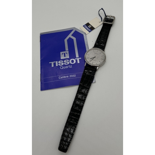 1135 - A men's Tissot Quartz 2032 wristwatch with patent strap, original tag and instruction booklet. Silve... 