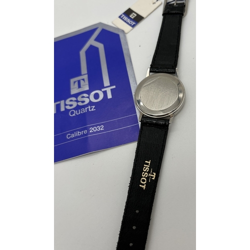 1135 - A men's Tissot Quartz 2032 wristwatch with patent strap, original tag and instruction booklet. Silve... 