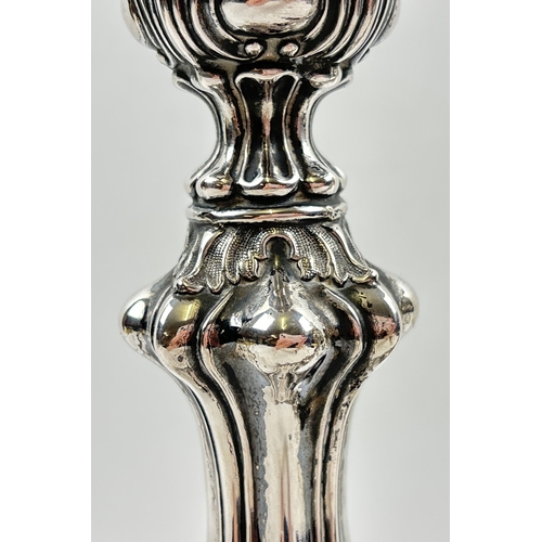 1154 - A pair of antique 13 loth silver candlesticks, possibly German or Austrian-Hungarian, in a Rococo st... 