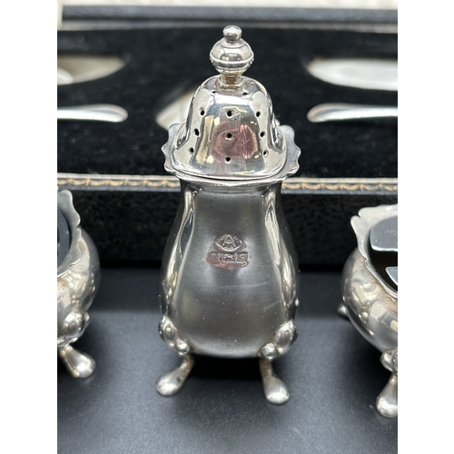 1156 - A vintage mid century silver cruet set, fully hallmarked for Adie Brothers, Birmingham 1956, in a St... 