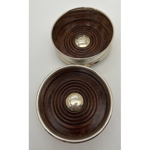 1172 - 2 modern silver plated coasters with wooden bases and black baize to underside. Tallest approx. 5cm ... 