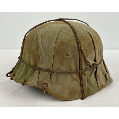 1211 - M40 German steel helmet shell painted field green complete with original camouflage cover and wire c... 