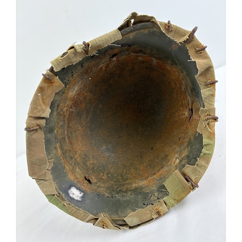 1211 - M40 German steel helmet shell painted field green complete with original camouflage cover and wire c... 