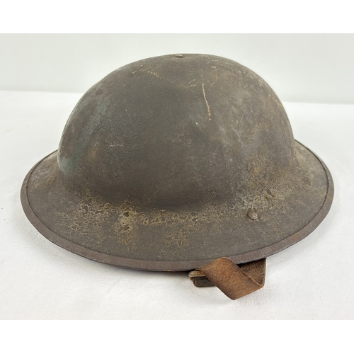 1216 - British-made WWI War Office Pattern steel helmet used by the US Army 1917-1918, stamped FS157. Beari... 