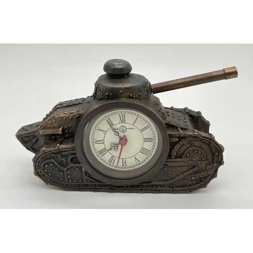 1225 - A bronzed metal desk clock modelled as a tank. With roman numeral markers and ornate pierced design ... 