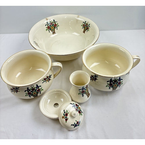 1251 - A vintage ceramic bathroom wash set decorated with floral design. Comprising: wash bowl, 2 x chamber... 