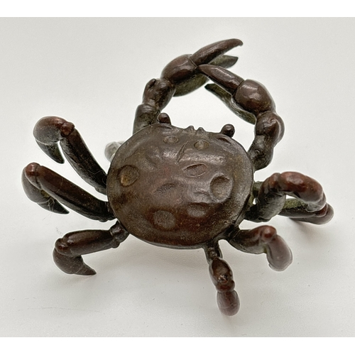 1286 - A small Japanese bronze modelled as a crab, with signature to underside of body. Approx. 3cm tall x ... 