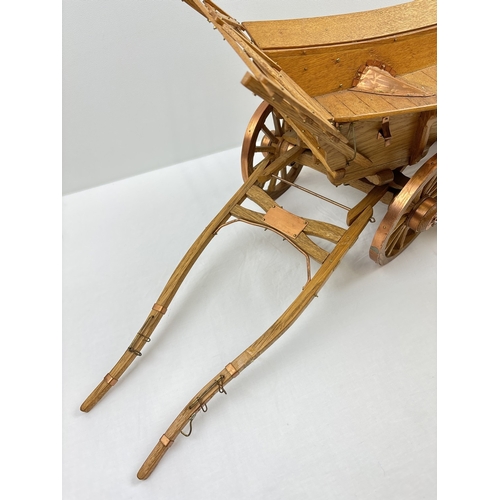 1388 - A wooden model of an Essex wagon with spoked wheels, bent heel shafts and copper & brass hardware. A... 