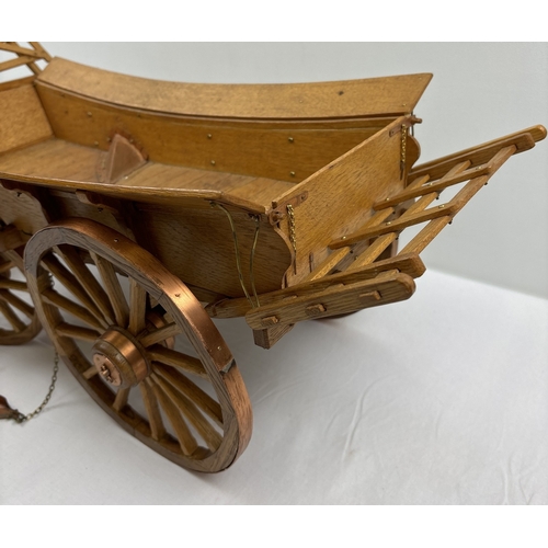 1388 - A wooden model of an Essex wagon with spoked wheels, bent heel shafts and copper & brass hardware. A... 