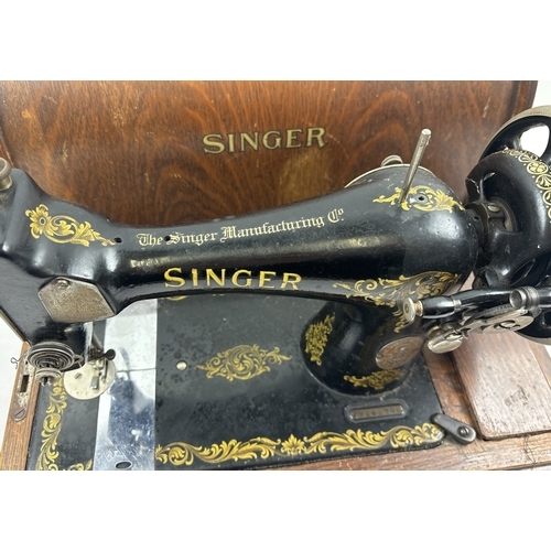 1400 - A Victorian wooden cased Singer hand sewing machine circa 1889 with shuttle style bobbin. Comes with... 