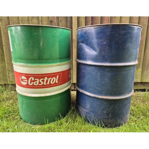 1413 - 2 large oil drums together with 2 vintage drum pumps. A 208L Castrol oil drum with advertising logo ... 