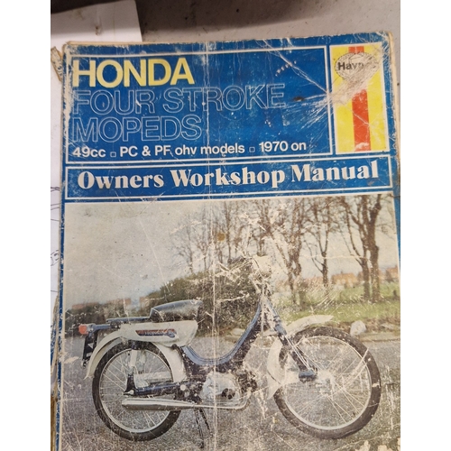 1456 - A collection of assorted motorcycle parts together with a Haynes Honda 4 stroke moped manual. Parts ... 