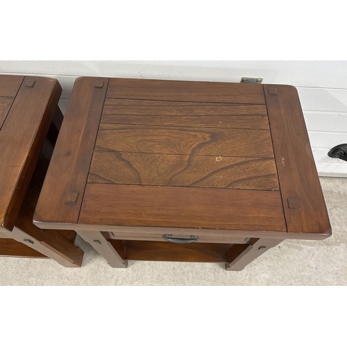 1461 - A pair of heavy solid mango wood 'Zocalo' side/lamp tables with central drawer and undershelf. Large... 