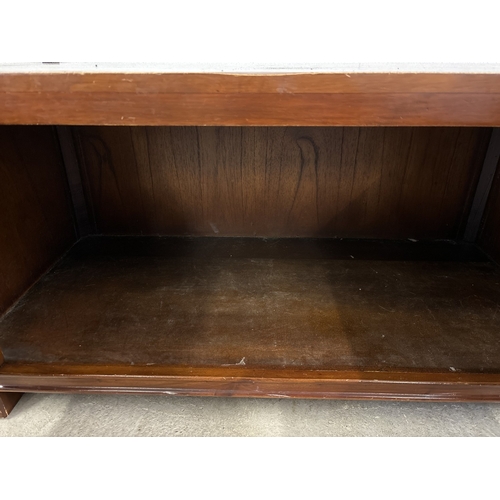 1463 - A large 'Zocalo' mango wood coffee table with double door cupboard and metal knob handles. With pane... 