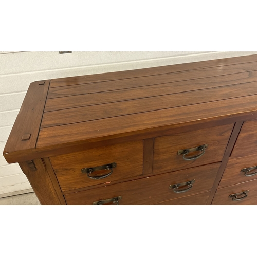 1465 - A large 'Zocalo' heavy solid mango wood 10 draw sideboard unit with heavy metal drop handles. Approx... 