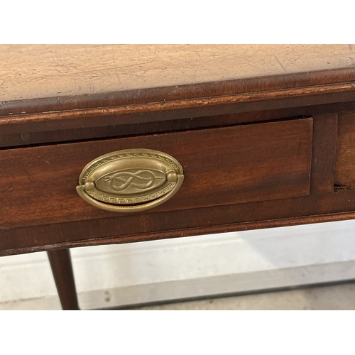 1470 - A Georgian dark wood 3 drawer side or writing table with turned legs. Brass drop handles (not origin... 