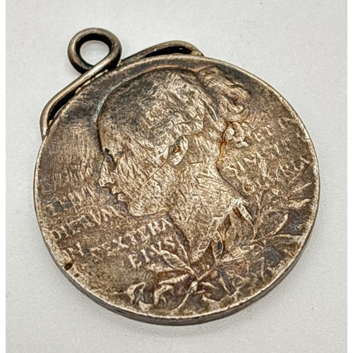 1186 - A silver Victoria 1897 Diamond Jubilee commemorative medallion with twisted design hanging bale fixe... 