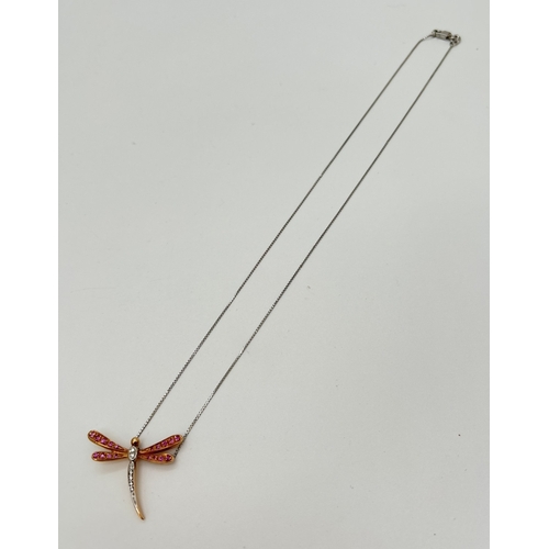 1141 - A boxed 18ct gold, pink sapphire and diamond set dragonfly pendant necklace. A rose gold dragonfly p... 