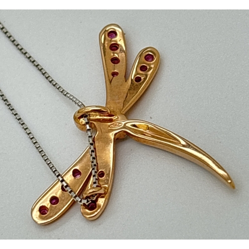 1141 - A boxed 18ct gold, pink sapphire and diamond set dragonfly pendant necklace. A rose gold dragonfly p... 