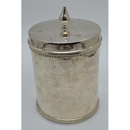 1183 - A modern silver plated lidded coffee canister with imprinted design to front and turned finial lid. ... 