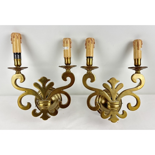 1202 - A pair of vintage Gothic style double wall sconces. Fleur De Lis design body with faux candle bulb h... 