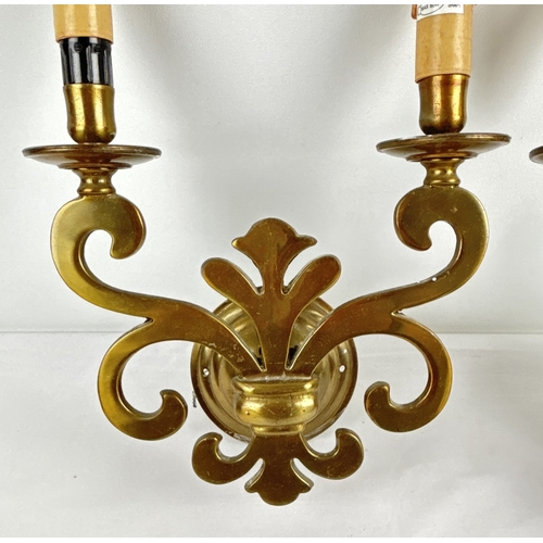 1202 - A pair of vintage Gothic style double wall sconces. Fleur De Lis design body with faux candle bulb h... 