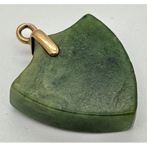 1019 - A vintage Nephrite jade shield shaped pendant/charm with yellow gold bale. Unmarked but tests as 9ct... 