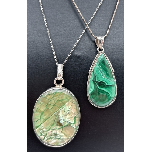 1039 - 2 natural stone silver pendant necklaces. A pear cut malachite stone with beaded detail to mount, on... 