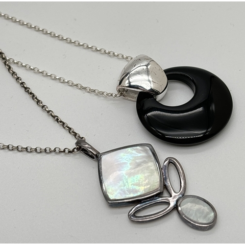 1048 - 2 modern design pendant necklaces. A drop pendant set with a square and oval of mother of pearl, on ... 