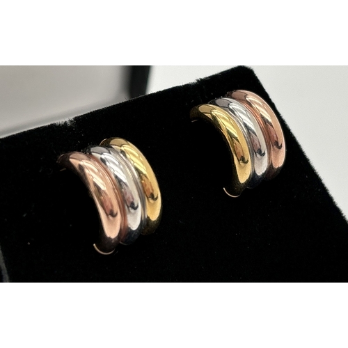 1055 - A pair of 9ct tri coloured gold half hoop earrings with butterfly backs. Each earring has a band of ... 