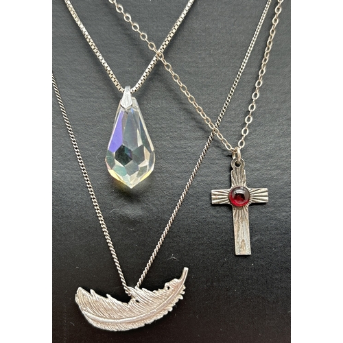 1056 - 3 silver pendant necklaces. A crystal teardrop pendant on a 15