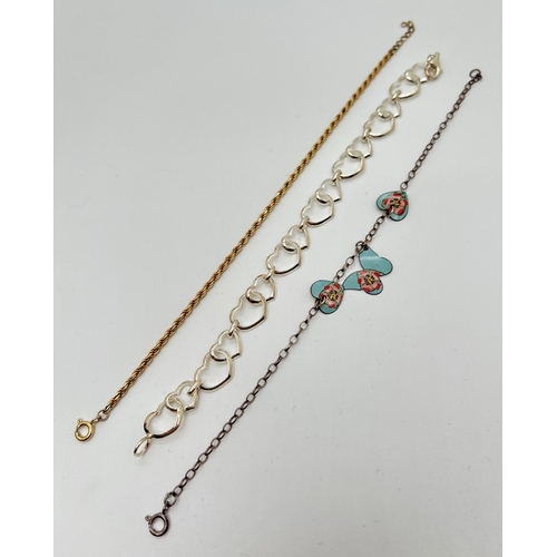 1059 - 3 silver bracelets. A silver gilt rope chain, a open heart link bracelet and a belcher chain bracele... 