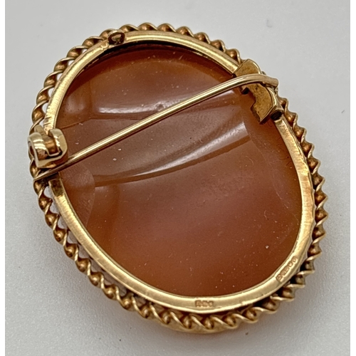 1064 - A vintage 9ct gold oval cameo brooch with twisted rope design mount. Fully hallmarked to reverse of ... 